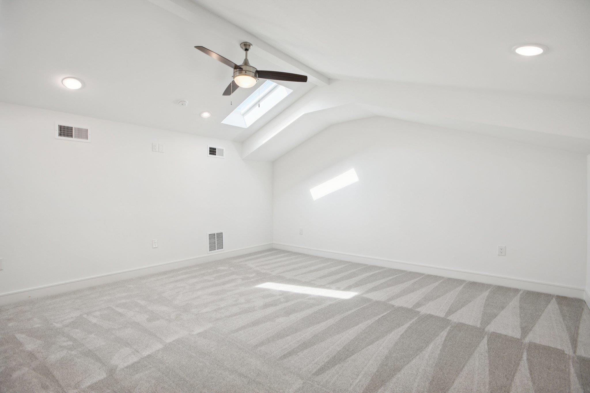 302 Tesla Circle Austin, TX 78681 - Photo 36 of 40 an empty room with a ceiling fan and window