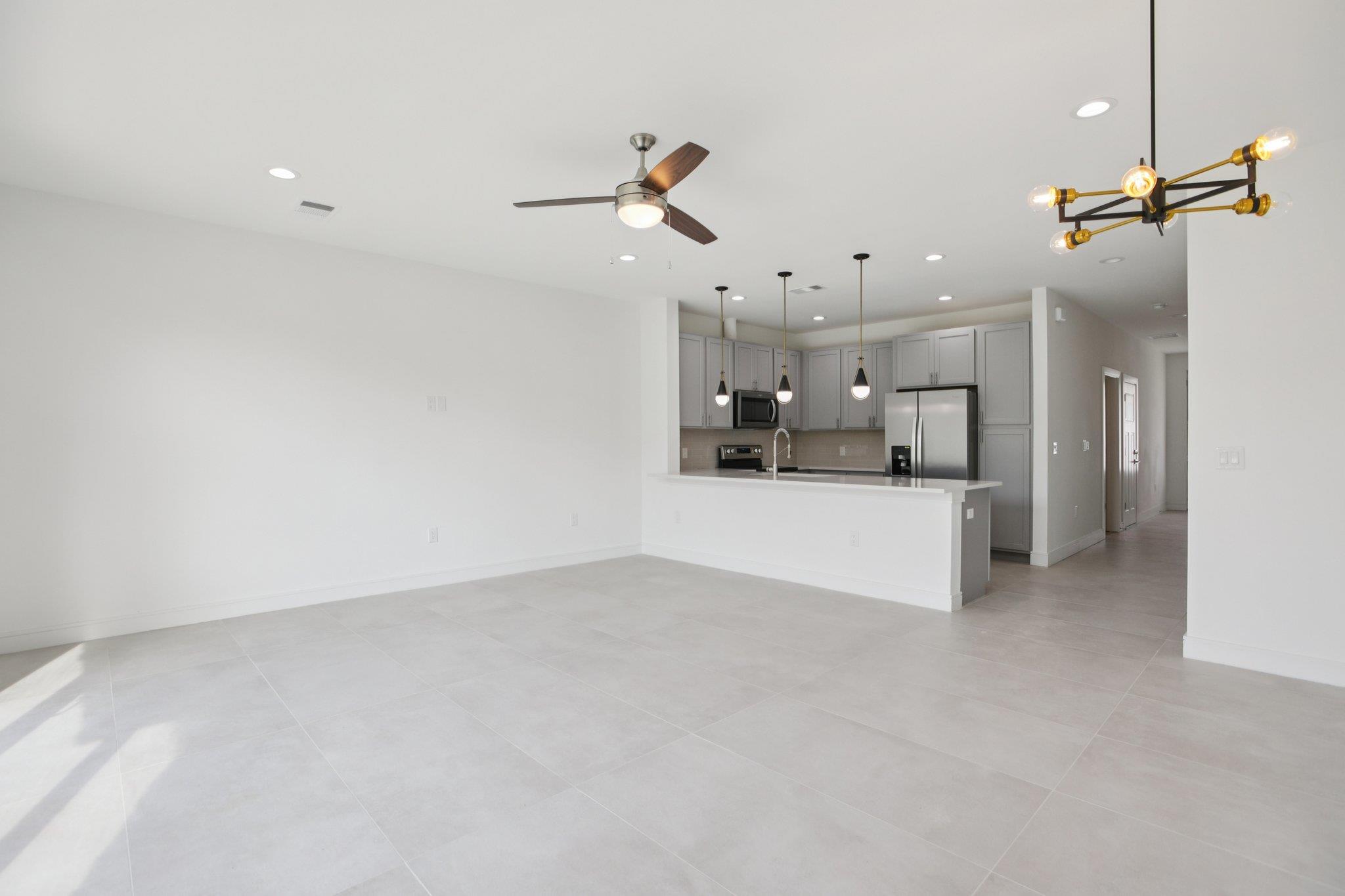302 Tesla Circle Austin, TX 78681 - Photo 9 of 40 a view of a kitchen with a sink and cabinets