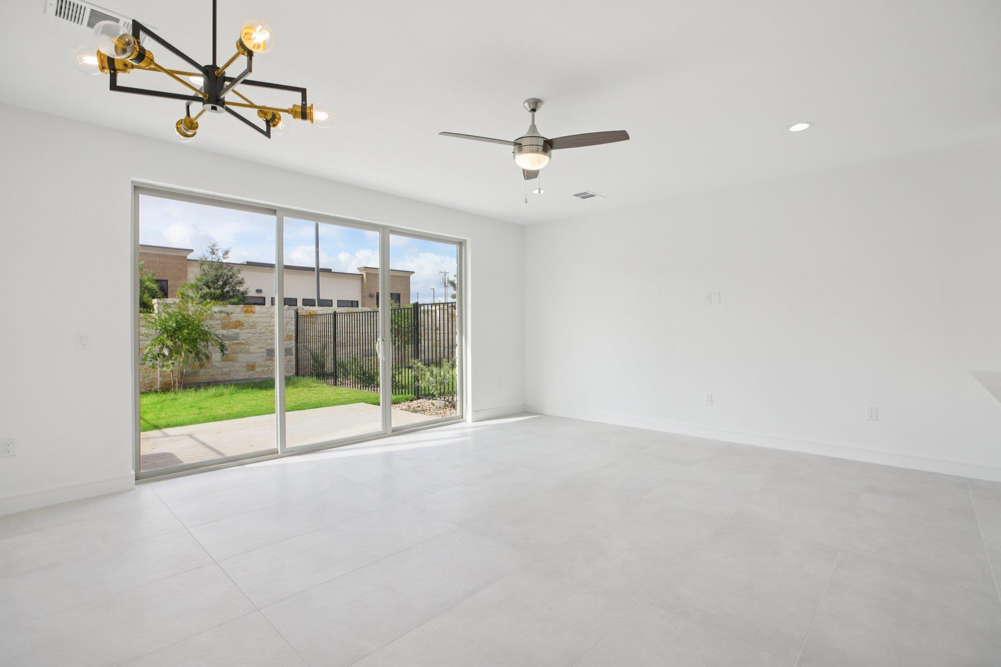 302 Tesla Circle Austin, TX 78681 - Photo 10 of 40 a view of room with window and ceiling fan