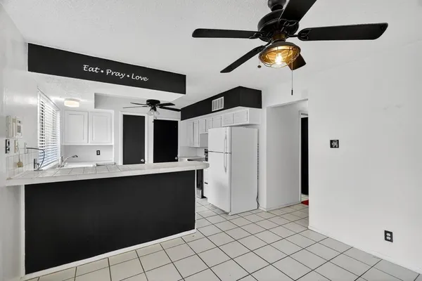 a kitchen with a sink stainless steel appliances and cabinets