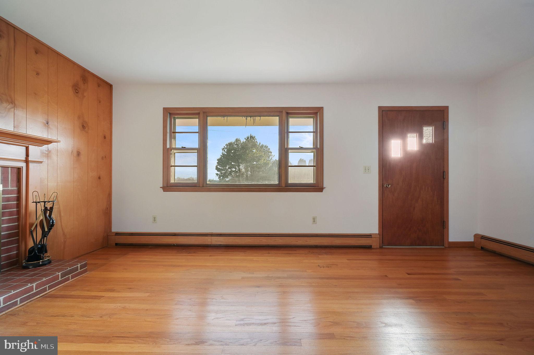 955 Twin Willows Road Smyrna, DE 19977 - Photo 17 of 27 a view of an empty room with wooden floor and a window