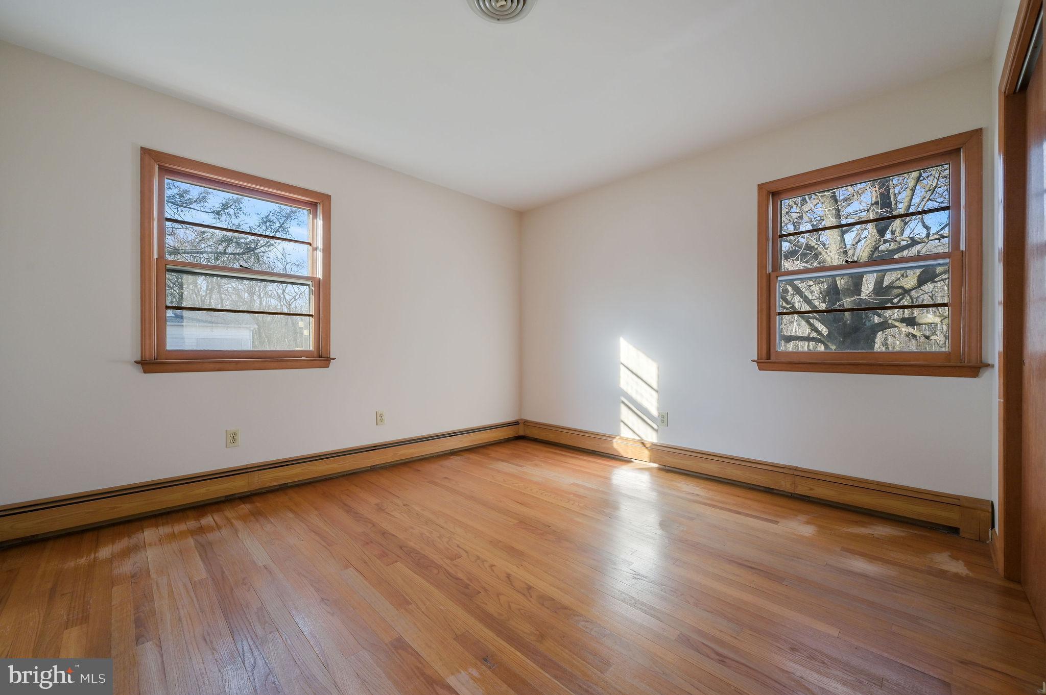955 Twin Willows Road Smyrna, DE 19977 - Photo 19 of 27 a view of an empty room with wooden floor and a window