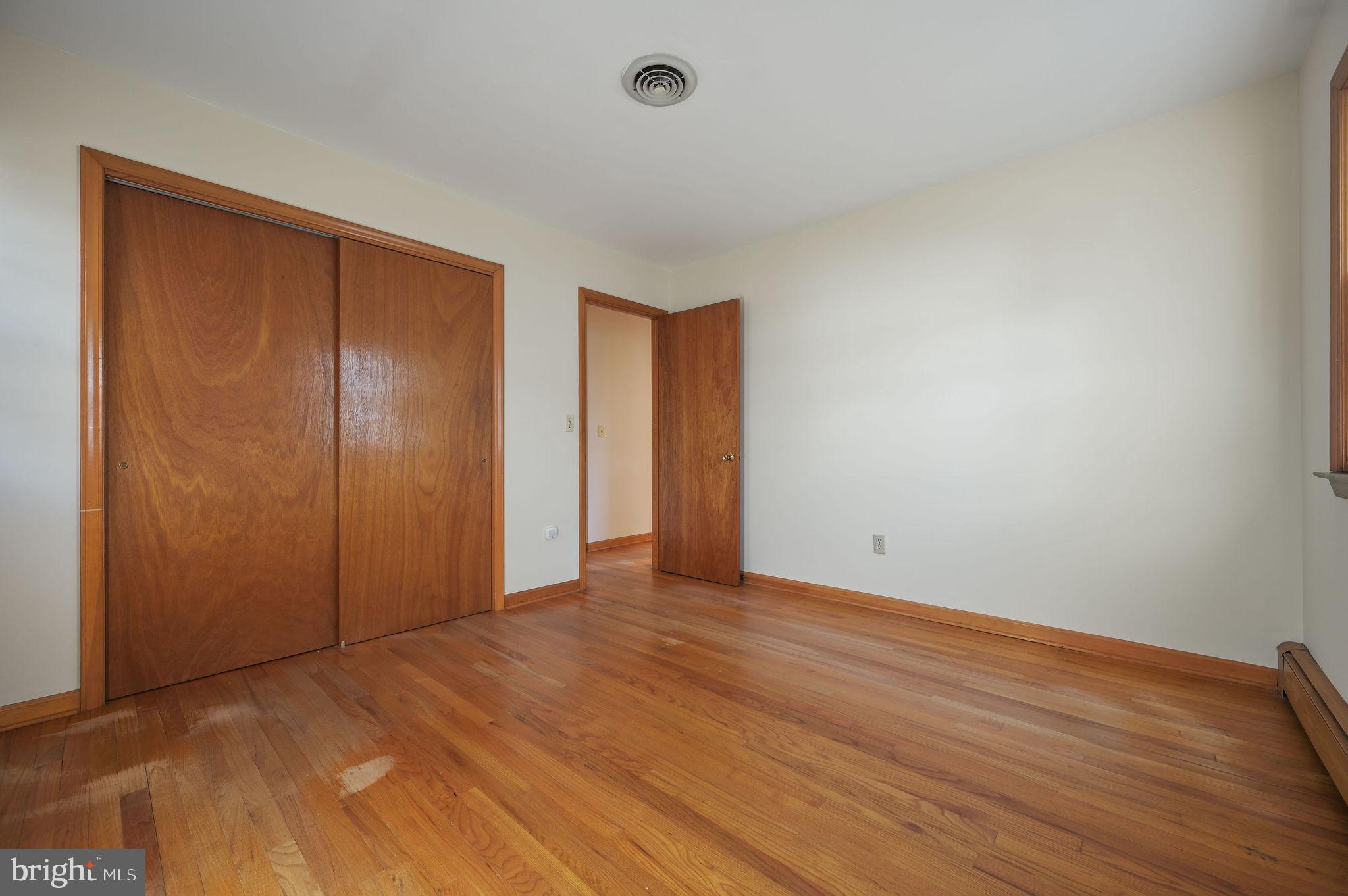 955 Twin Willows Road Smyrna, DE 19977 - Photo 20 of 27 a view of an empty room with wooden floor and closet
