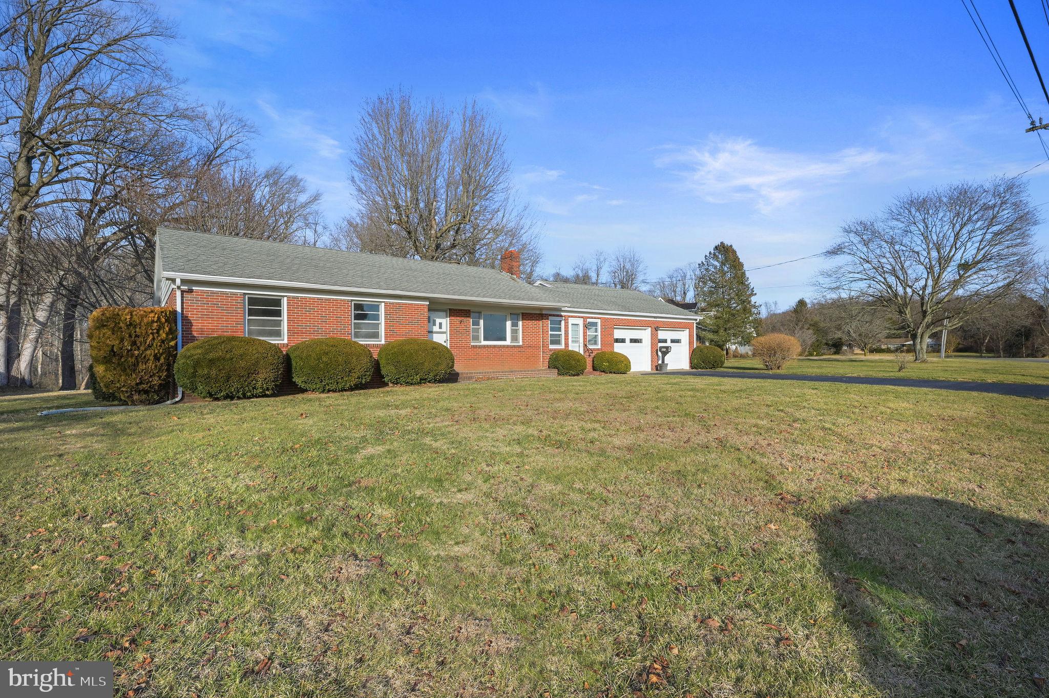 955 Twin Willows Road Smyrna, DE 19977 - Photo 2 of 27 a front view of house with yard and trees in the background