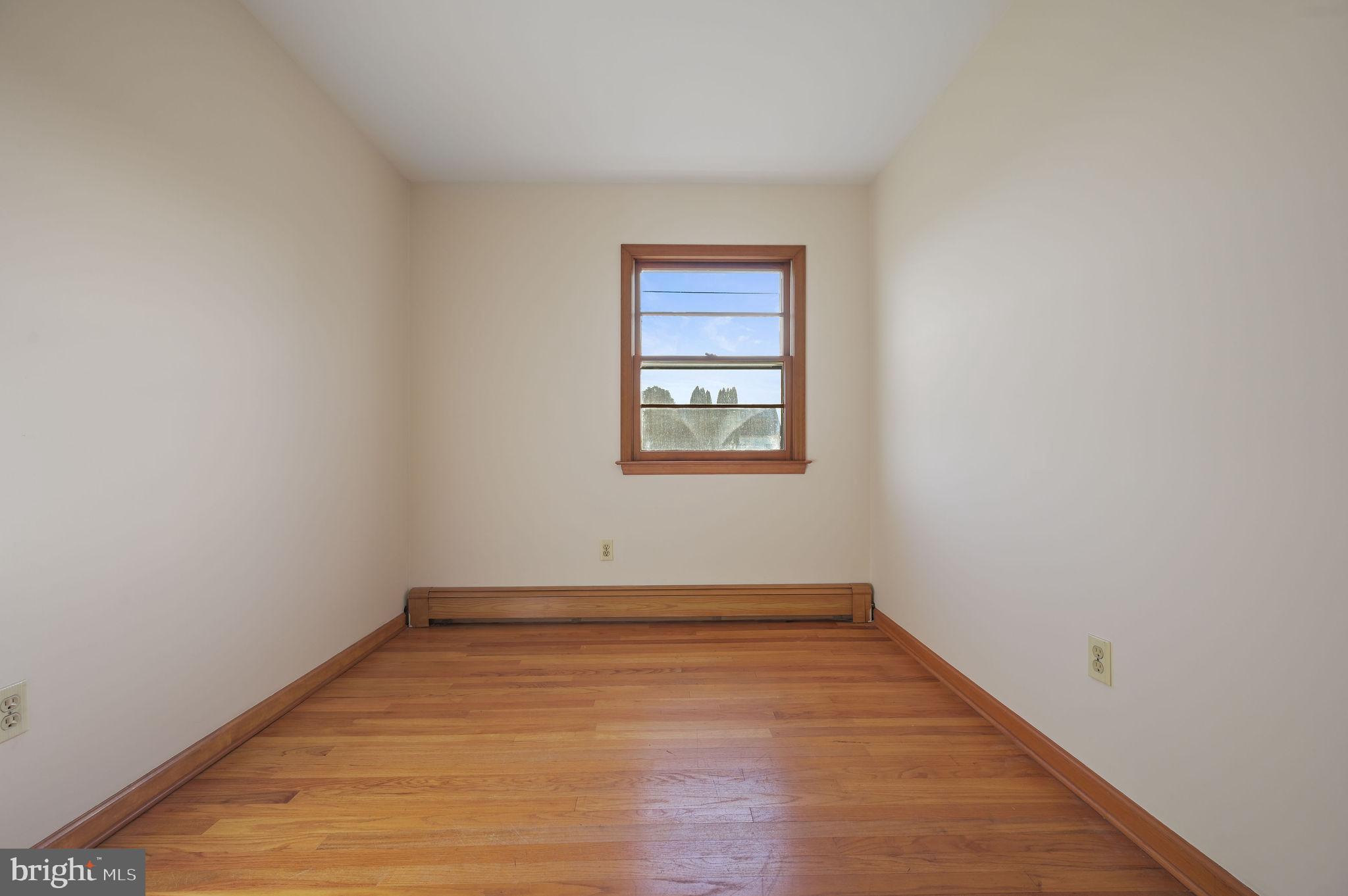 955 Twin Willows Road Smyrna, DE 19977 - Photo 22 of 27 wooden floor in an empty room with a window