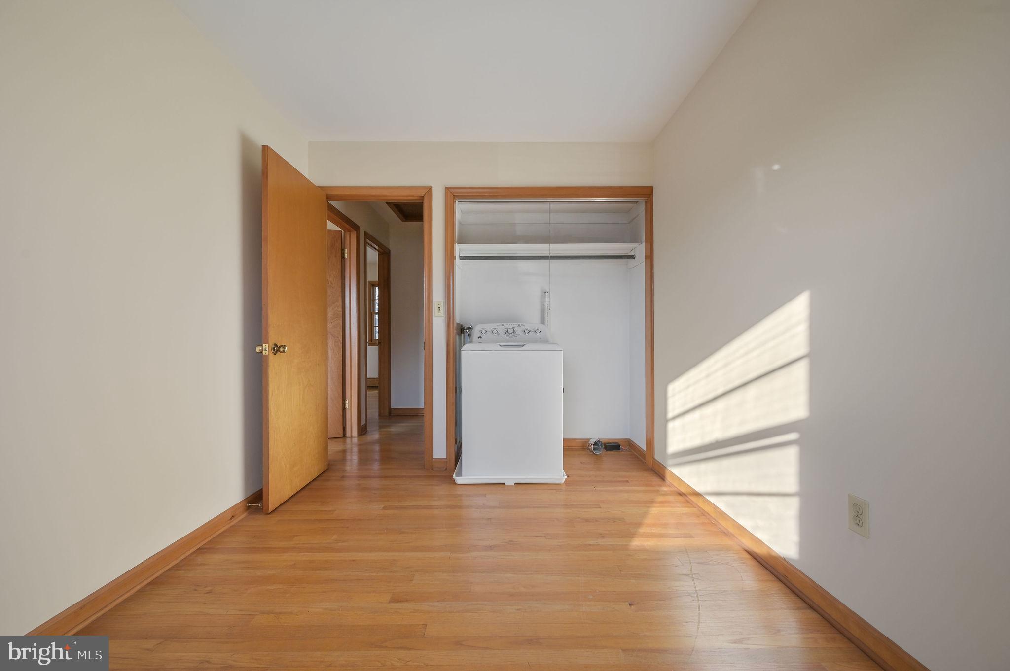 955 Twin Willows Road Smyrna, DE 19977 - Photo 23 of 27 a view of a room with wooden floor and stairs