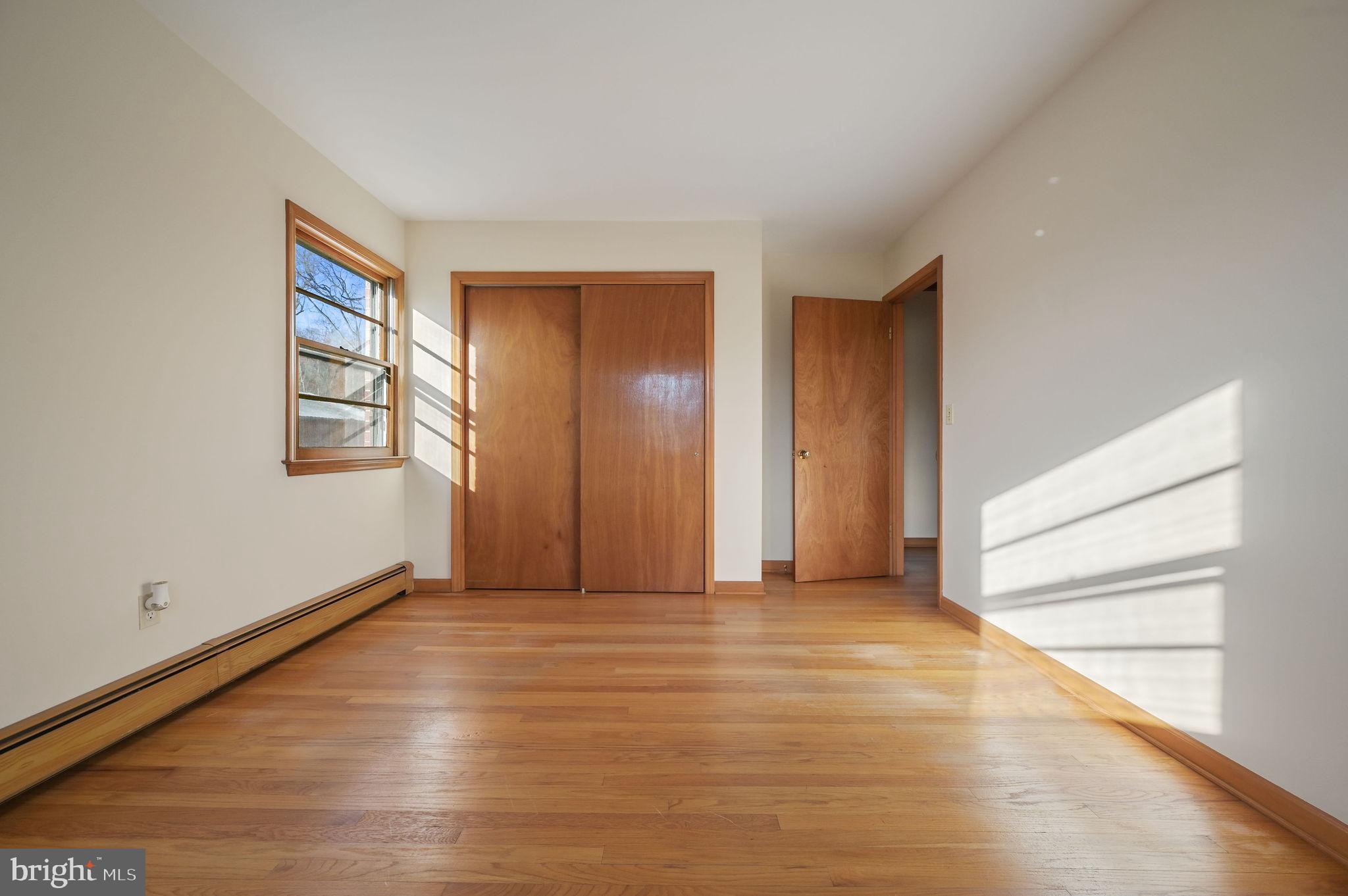 955 Twin Willows Road Smyrna, DE 19977 - Photo 25 of 27 a view of an empty room with wooden floor and a window