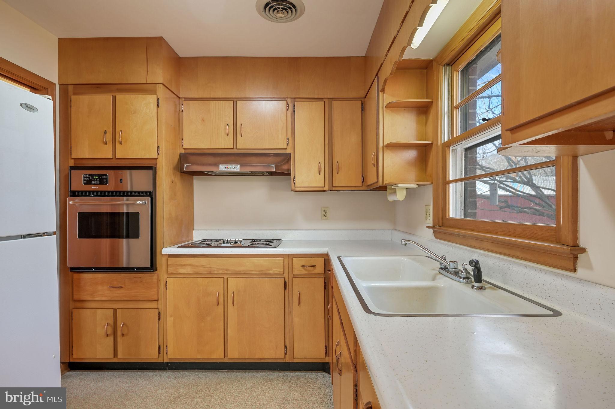 955 Twin Willows Road Smyrna, DE 19977 - Photo 10 of 27 a kitchen with stainless steel appliances granite countertop a sink and a stove