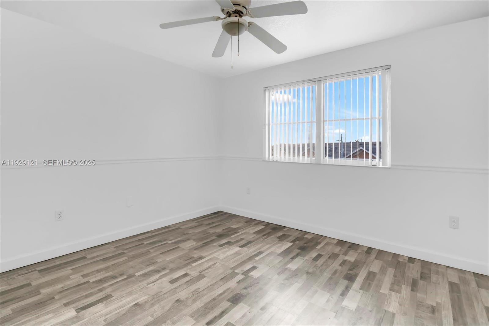 17710 Northwest 73rd Avenue, Unit 20120 Hialeah, FL 33015 - Photo 25 of 39 a view of an empty room with a window