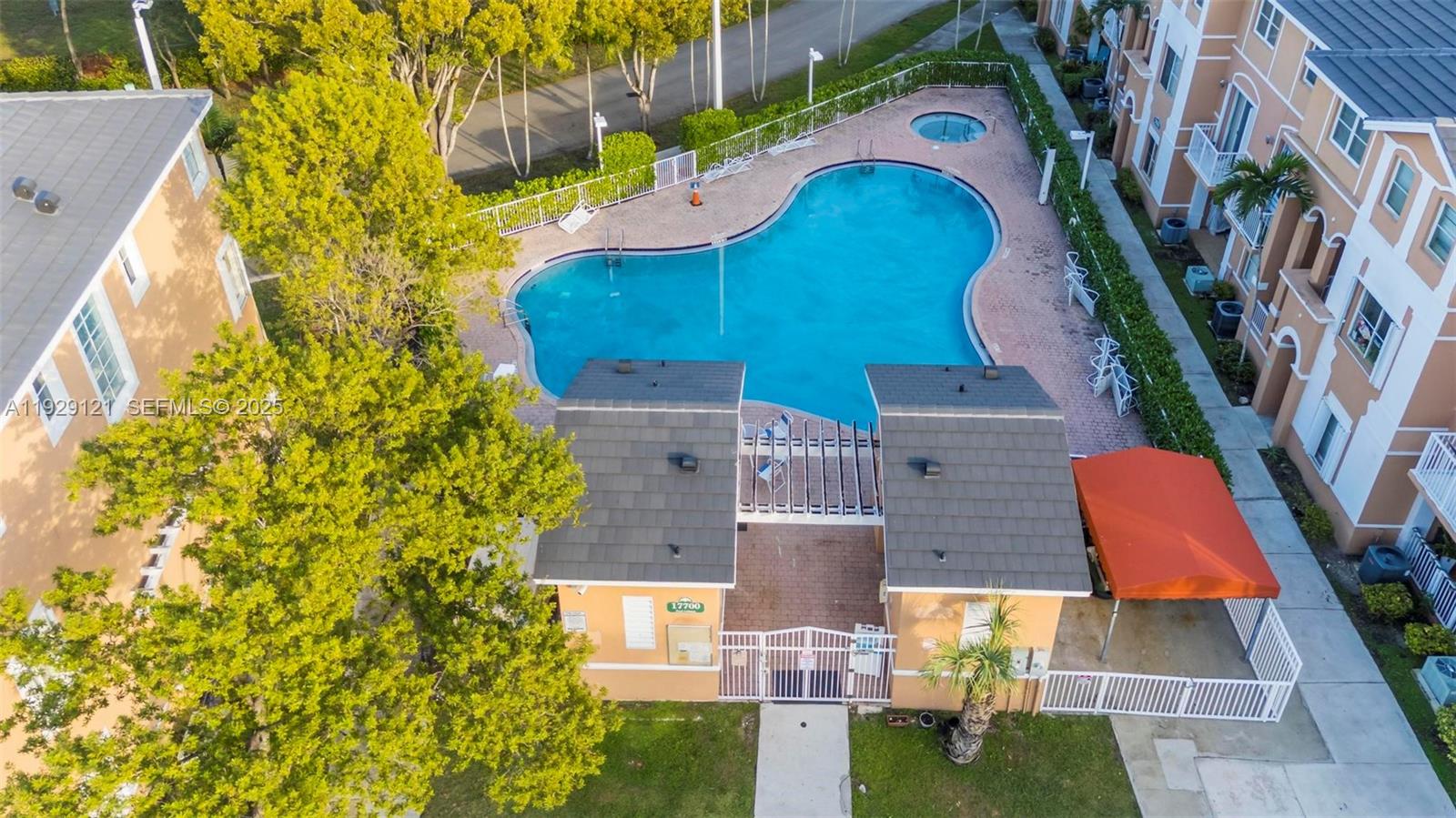 17710 Northwest 73rd Avenue, Unit 20120 Hialeah, FL 33015 - Photo 32 of 39 an aerial view of residential house with swimming pool