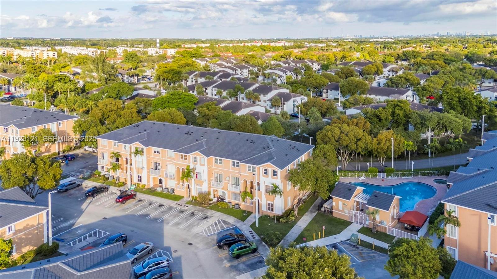 17710 Northwest 73rd Avenue, Unit 20120 Hialeah, FL 33015 - Photo 37 of 39 an aerial view of residential houses with outdoor space and swimming pool
