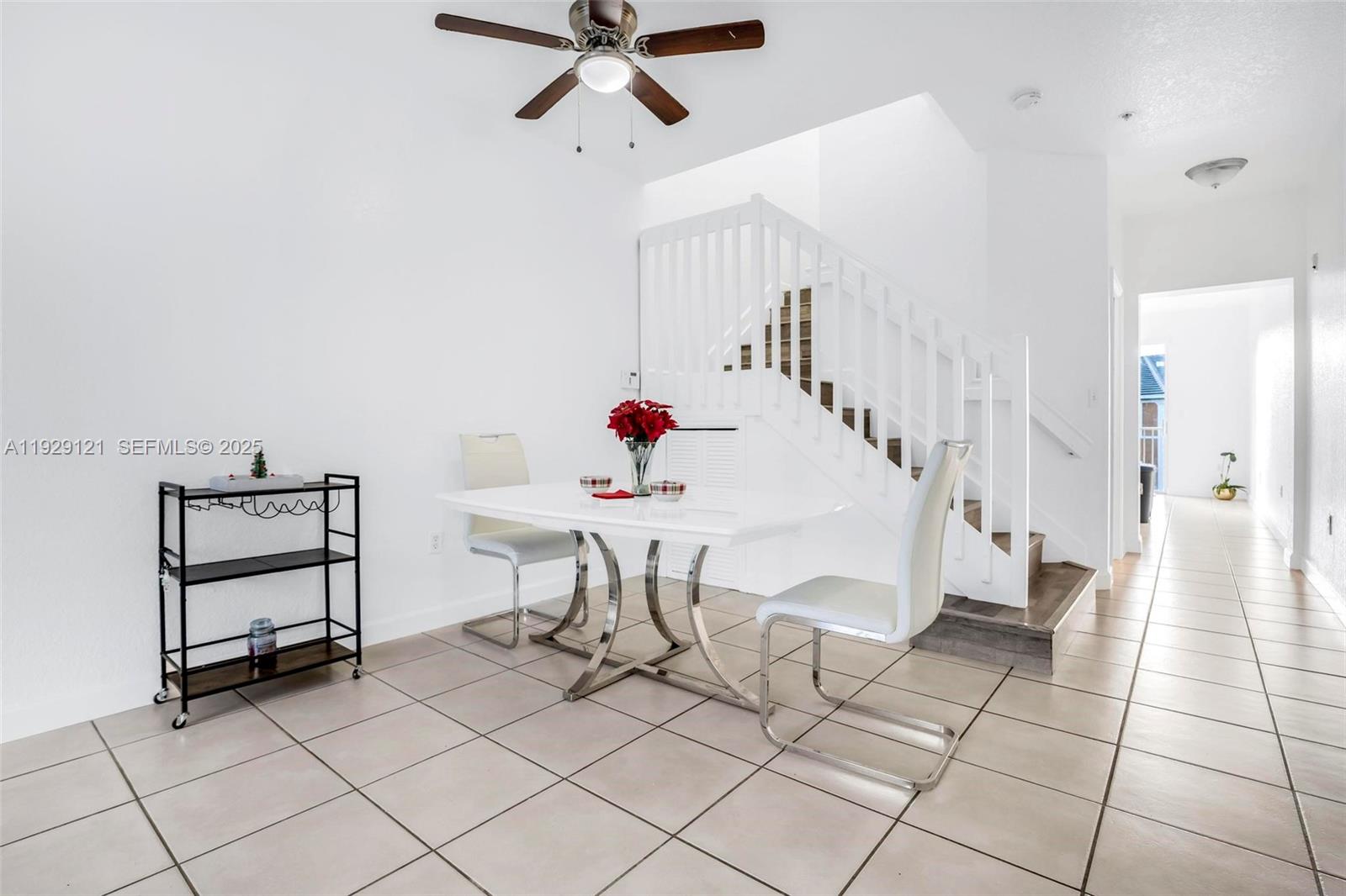 17710 Northwest 73rd Avenue, Unit 20120 Hialeah, FL 33015 - Photo 5 of 39 a view of a livingroom with furniture and white walls