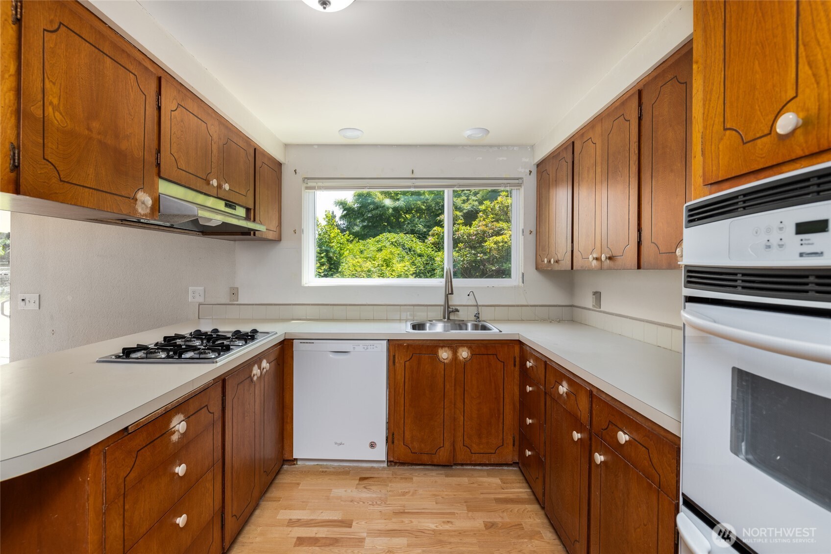 21316 Rolling Ridge Drive Sedro-Woolley, WA 98284 - Photo 11 of 37 a kitchen with stainless steel appliances granite countertop a sink stove and cabinets