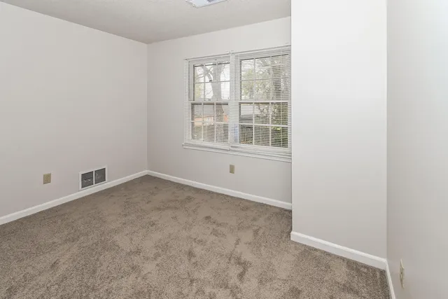 a bathroom with a bathtub and toilet