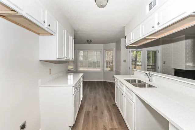 a kitchen with a sink and cabinets