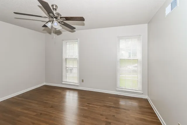a kitchen with stainless steel appliances granite countertop a sink and a wooden floors