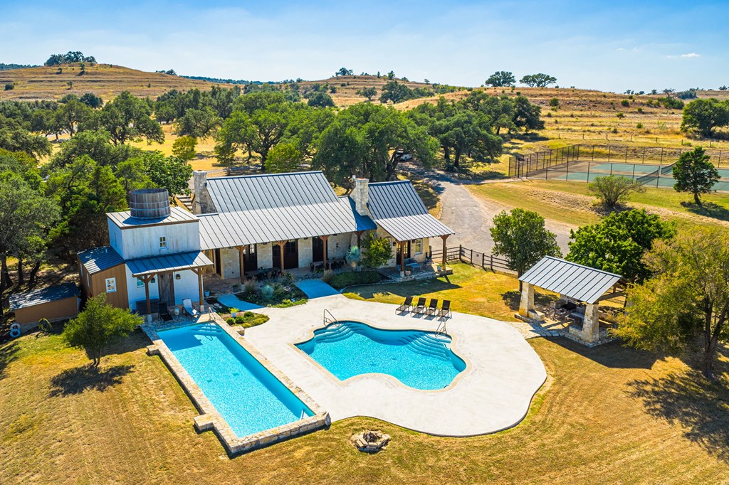 1495 Walnut Springs Road, Unit 68 Johnson City, TX 78636 - Photo 12 of 23 an aerial view of a house with swimming pool and ocean view