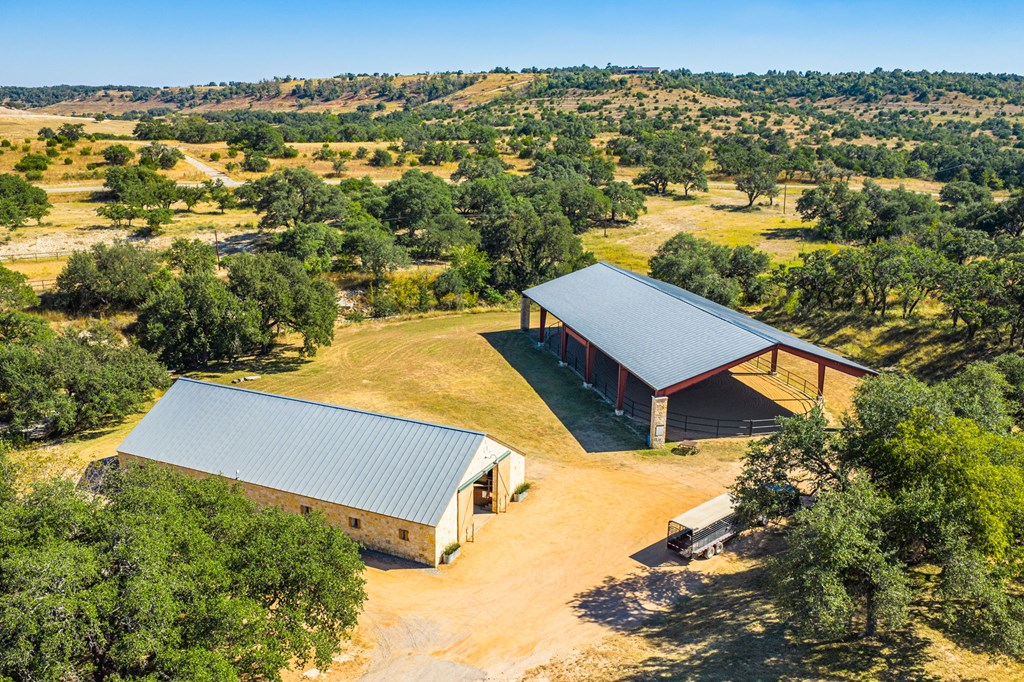 1495 Walnut Springs Road, Unit 68 Johnson City, TX 78636 - Photo 13 of 23 an aerial view of residential houses with outdoor space and trees