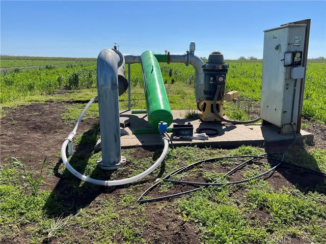 a view of a swimming pool with a yard