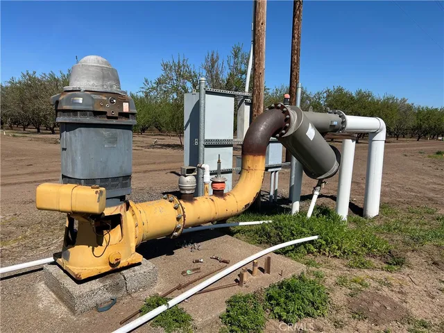 an aerial view of a house with outdoor space