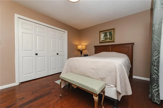 a bedroom with a bed and a table in it