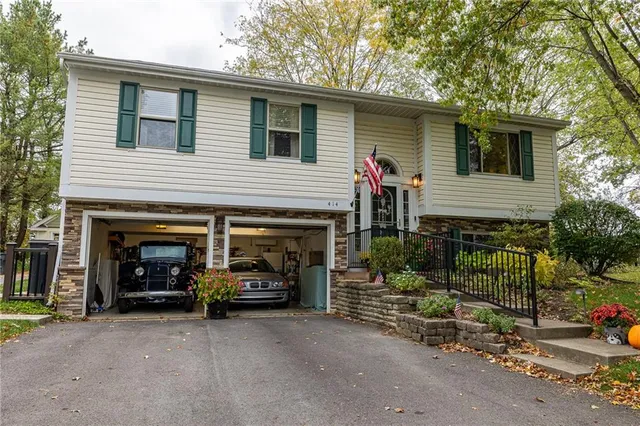 a view of a car parked in front of a house