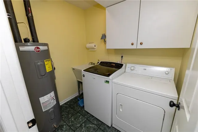 a bathroom with a granite countertop sink a toilet and a mirror