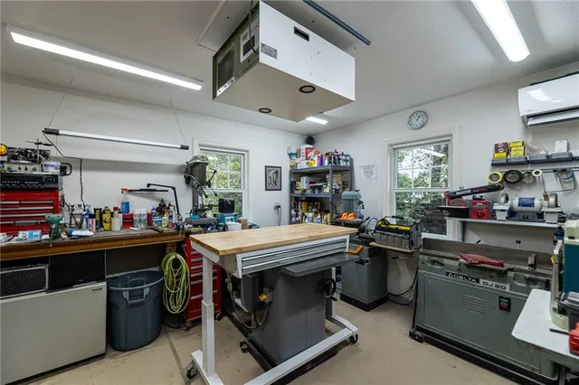 a room with gym equipment and a large window