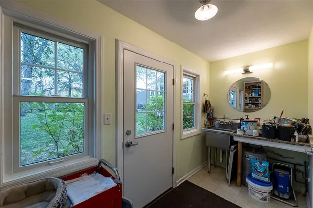 a white toilet sitting next to a shower