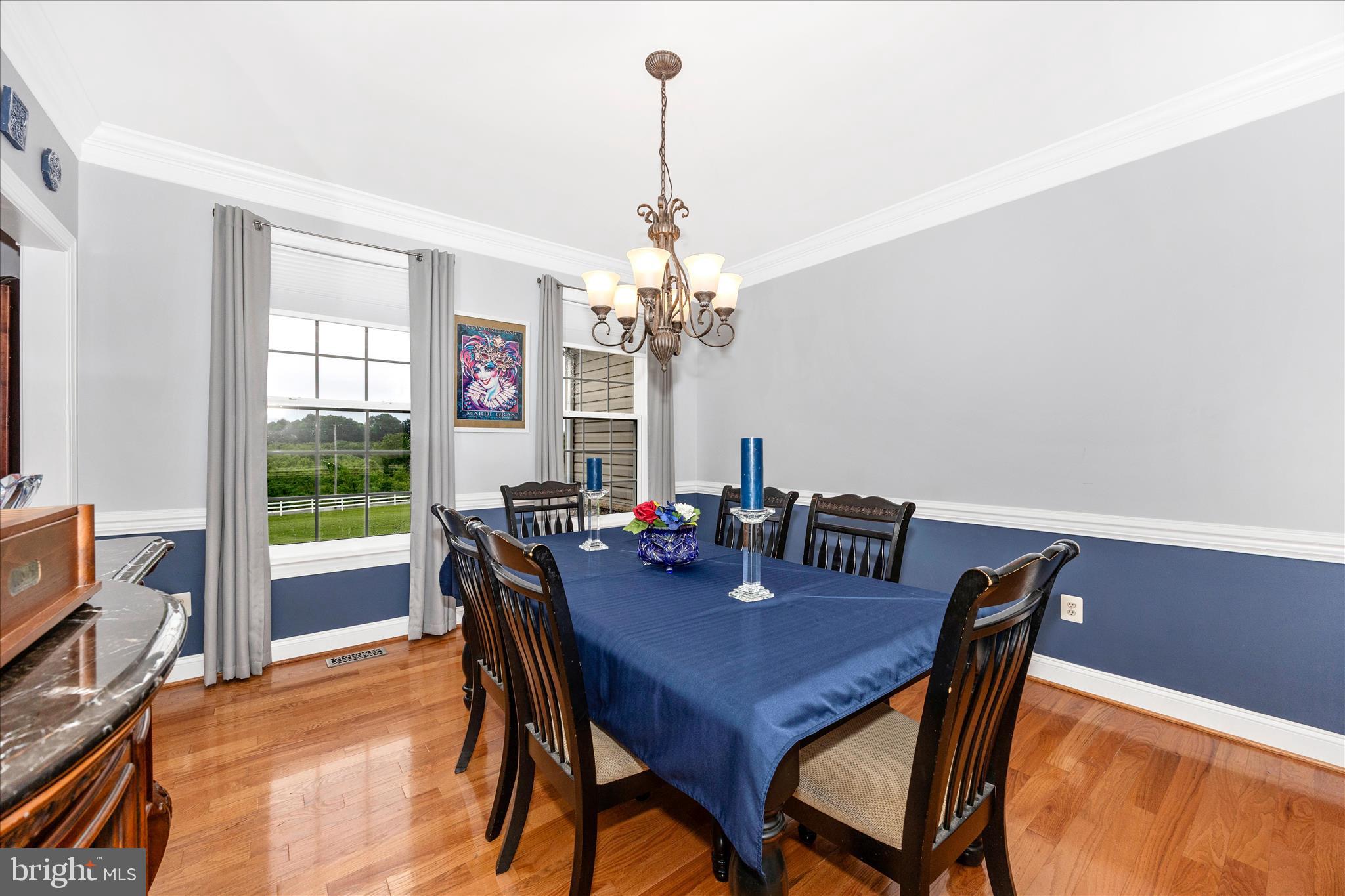 9855 McKinstry Mill Road New Windsor, MD 21776 - Photo 10 of 76 a view of a dining room with furniture window and wooden floor