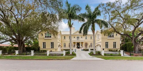 a dining room with table & chairs