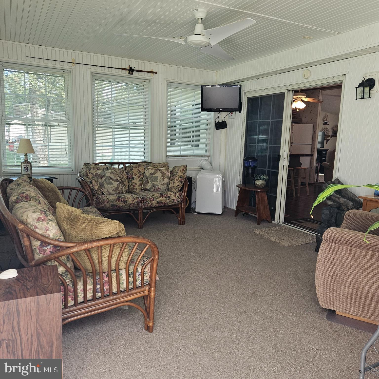 24212 Durham Street Georgetown, DE 19947 - Photo 11 of 21 a bedroom with bed couch and window