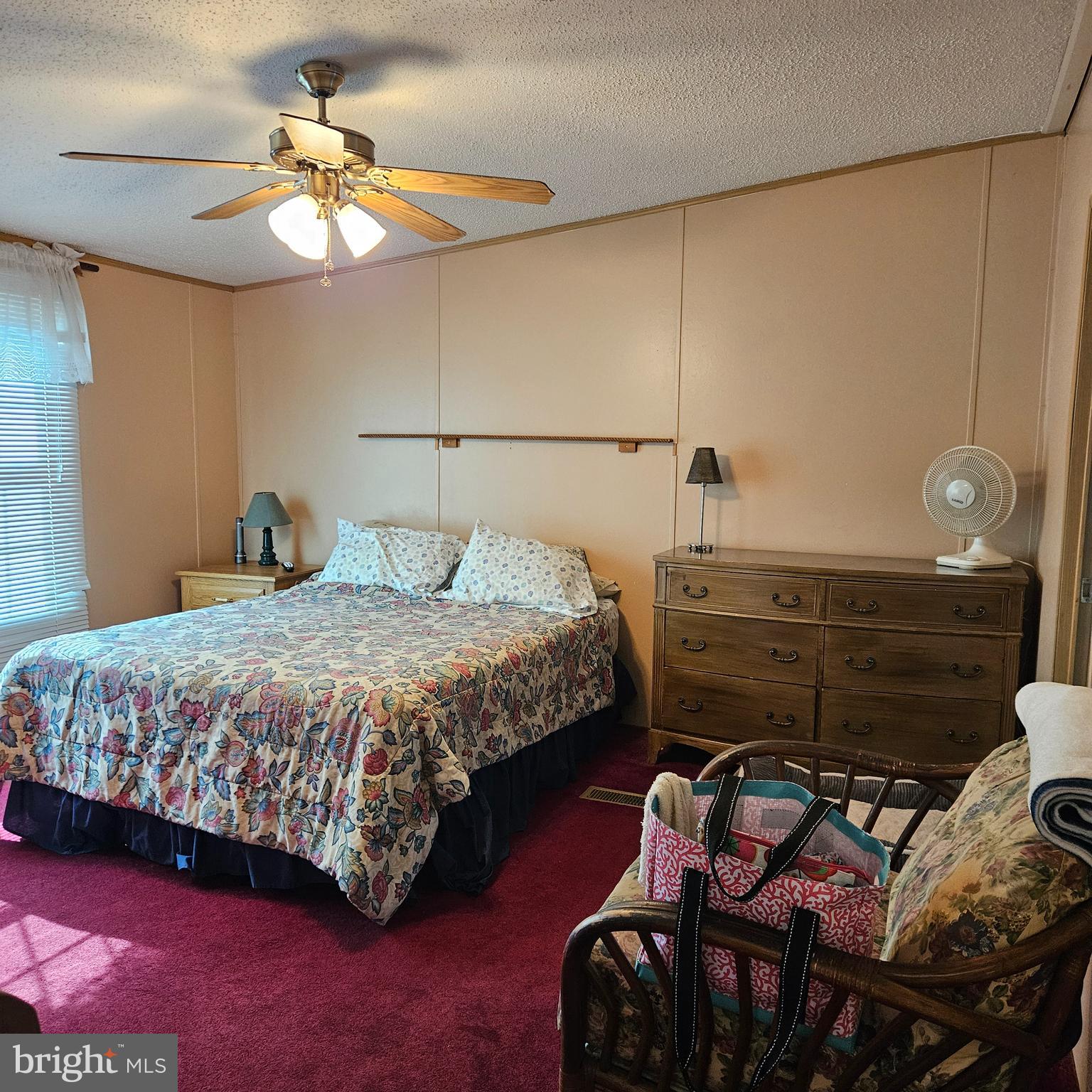 24212 Durham Street Georgetown, DE 19947 - Photo 13 of 21 a bedroom with a bed and chandelier