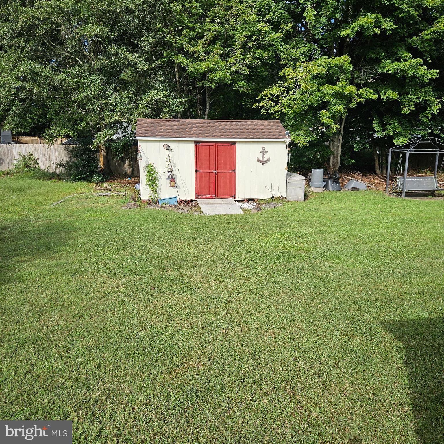 24212 Durham Street Georgetown, DE 19947 - Photo 19 of 21 a view of a backyard with a garden and entertaining space