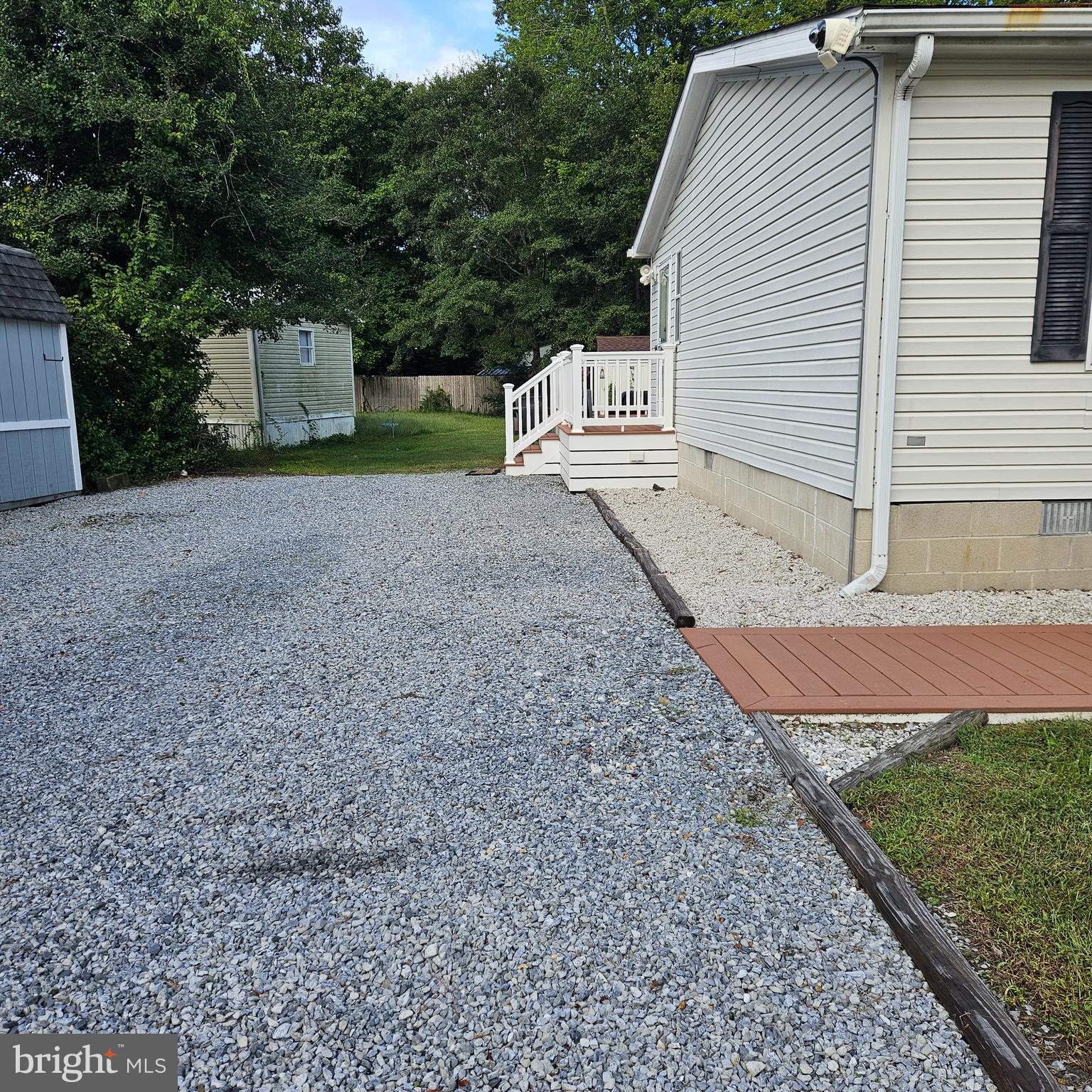 24212 Durham Street Georgetown, DE 19947 - Photo 3 of 21 a view of a house with backyard and trees