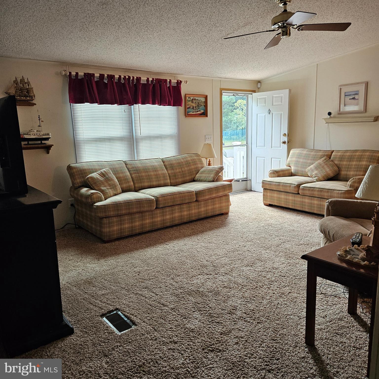24212 Durham Street Georgetown, DE 19947 - Photo 5 of 21 a living room with furniture and a window