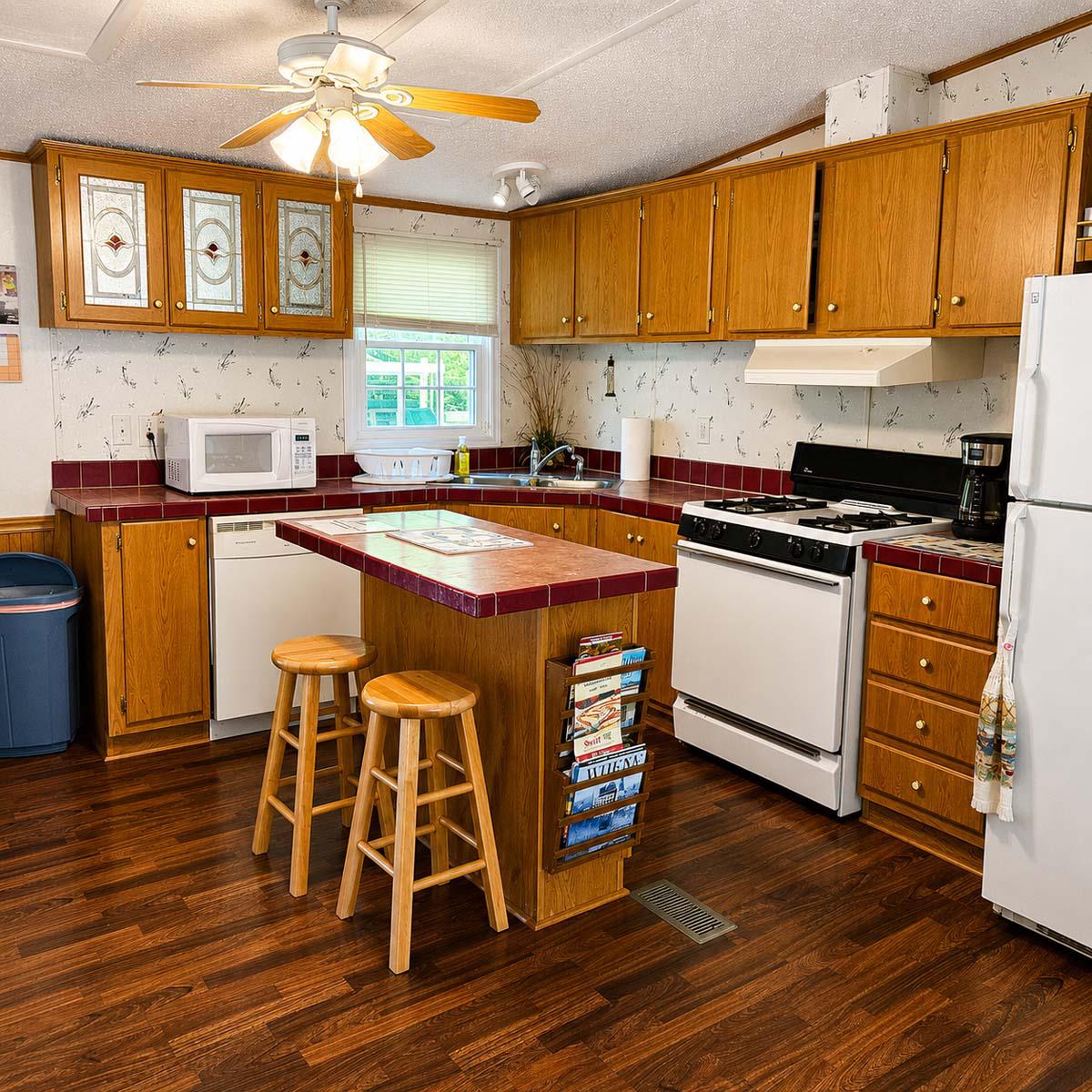 24212 Durham Street Georgetown, DE 19947 - Photo 7 of 21 Well-equipped kitchen with warm wooden tones