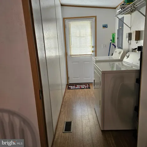 a view of a kitchen from the hallway