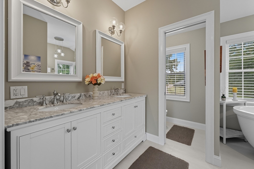 40 East Street Topsfield, MA 01983 - Photo 12 of 39 a bathroom with a granite countertop sink and a mirror
