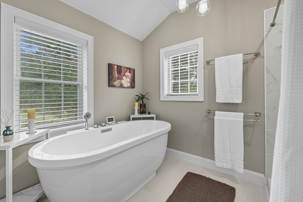 40 East Street Topsfield, MA 01983 - Photo 13 of 39 a white bath tub sitting next to a white sink