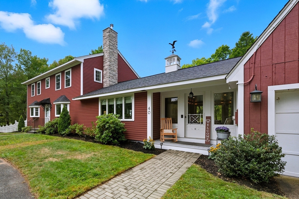 40 East Street Topsfield, MA 01983 - Photo 2 of 39 a front view of a house with garden