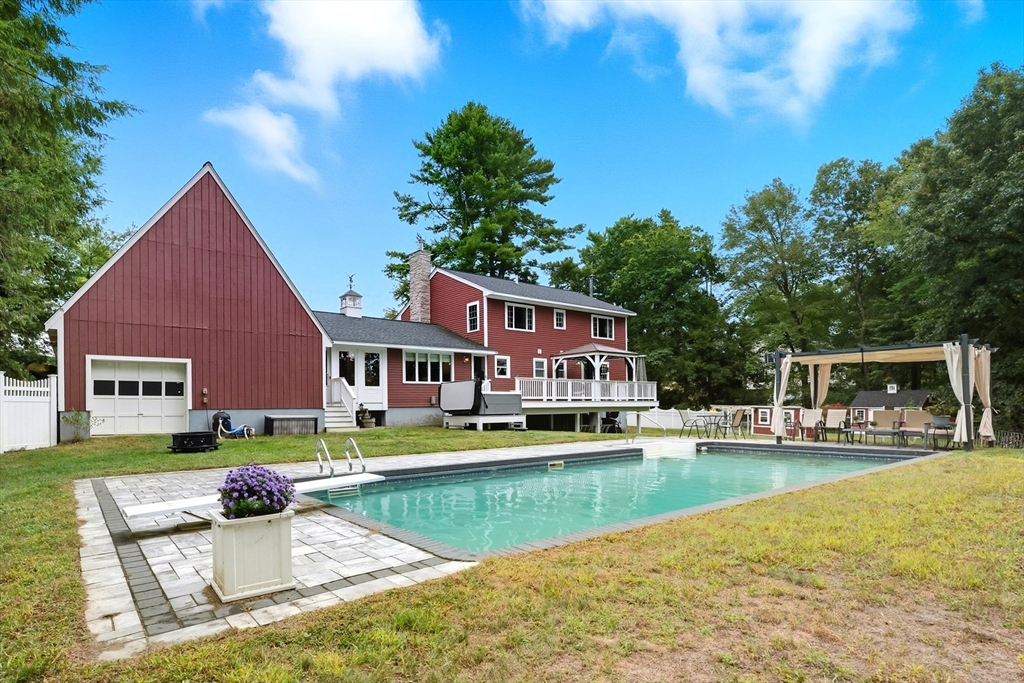 40 East Street Topsfield, MA 01983 - Photo 32 of 39 a front view of a house with swimming pool having outdoor seating