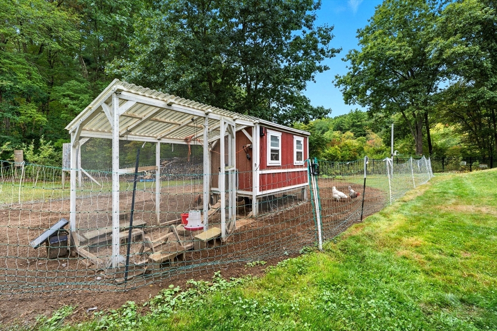 40 East Street Topsfield, MA 01983 - Photo 36 of 39 a view of a chair and table in backyard of the house