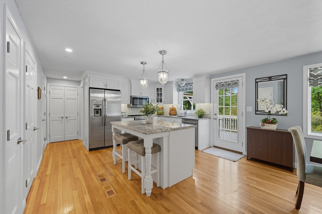 40 East Street Topsfield, MA 01983 - Photo 5 of 39 a kitchen with stainless steel appliances granite countertop a sink stove and a refrigerator
