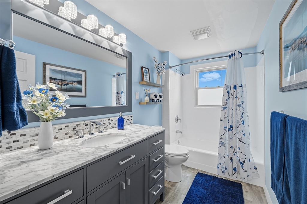 40 East Street Topsfield, MA 01983 - Photo 8 of 39 a bathroom with a sink a toilet and shower