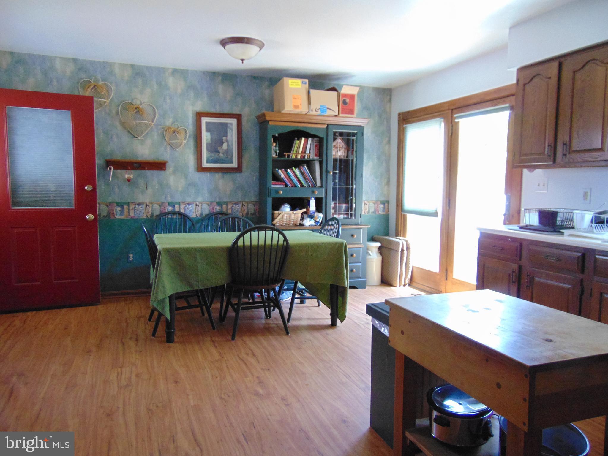 8411 Berkfield Road Baltimore, MD 21237 - Photo 10 of 23 Kitchen leads to large deck & fenced yard