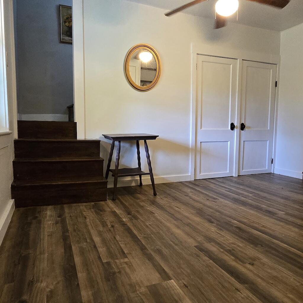 2638 Fishers View Road Shawsville, VA 24162 - Photo 29 of 46 a view of a livingroom with wooden floor and a staircase