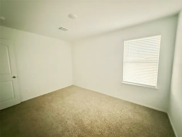 a bathroom with a sink toilet and a mirror