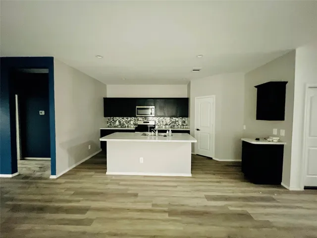 a view of living room with furniture and flat screen tv
