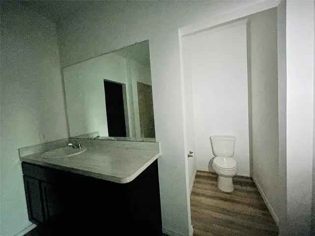 a bathroom with a shower and a sink
